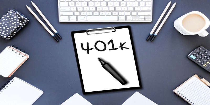contains a sheet pinned onto a notepad with a text '401k' written on it along with a pen, pencil, key notes, key board, calculator, and tea cup surrounded by it.
